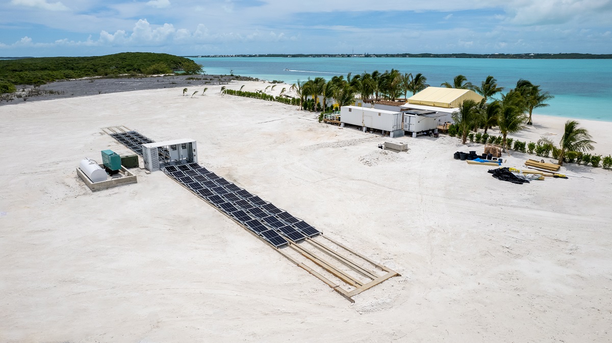 Solarator® Fold-Out 75+ kVa fully deployed along a stretch of white sand beach
