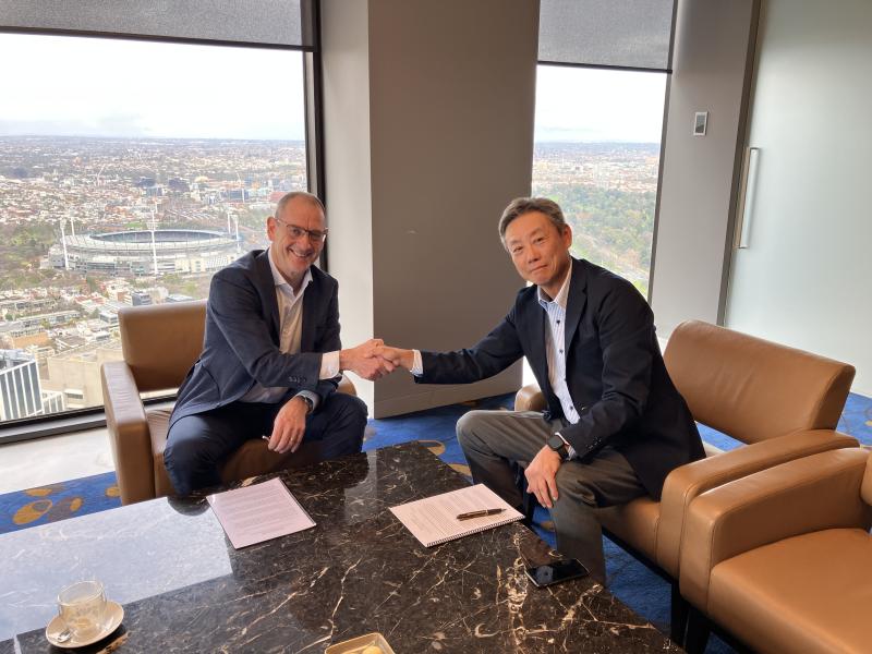 Peter Galvin (L) and Noriaki Sunohara (R) shake hands to symbolise partnership